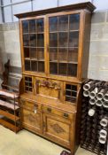 Lamb of Manchester. A late Victorian oak and pollard oak secretaire bookcase, width 125cm, depth