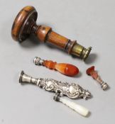 Four 19th century decorative handled seals and a larger wooden handles seal-9cms long,