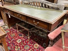 A reproduction George III style mahogany three drawer writing table, width 151cm, depth 74cm, height