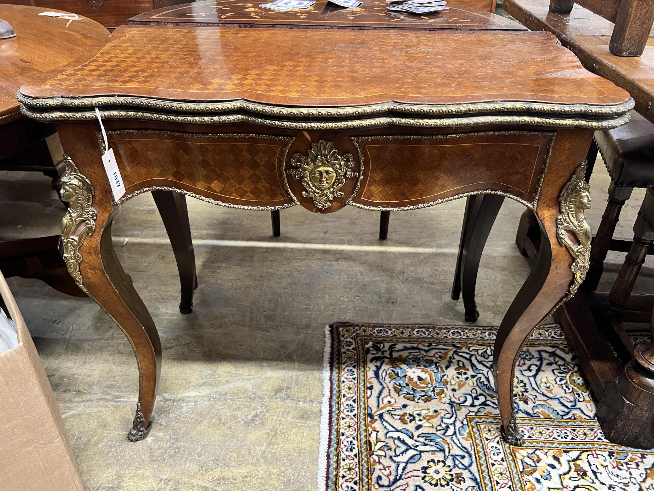 A French transitional style parquetry inlaid gilt metal mounted folding card table, width 85cm,