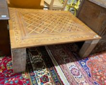 A rectangular parquetry coffee table, width 115cm, depth 89cm, height 40cm