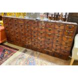 A 19th century mahogany and pine 66 drawer apothecary chest with turned wood handles and some