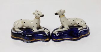 A pair of Staffordshire porcelain dalmations, c.1840, 9.5cms wide