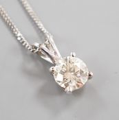 A modern 750 white metal and solitaire diamond set pendant, overall 14mm, on an 18ct white gold fine