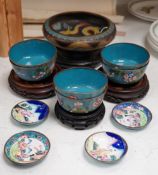 A Chinese cloisonné enamel 'dragon' bowl, six Chinese floral cloisonné enamel bowls and four