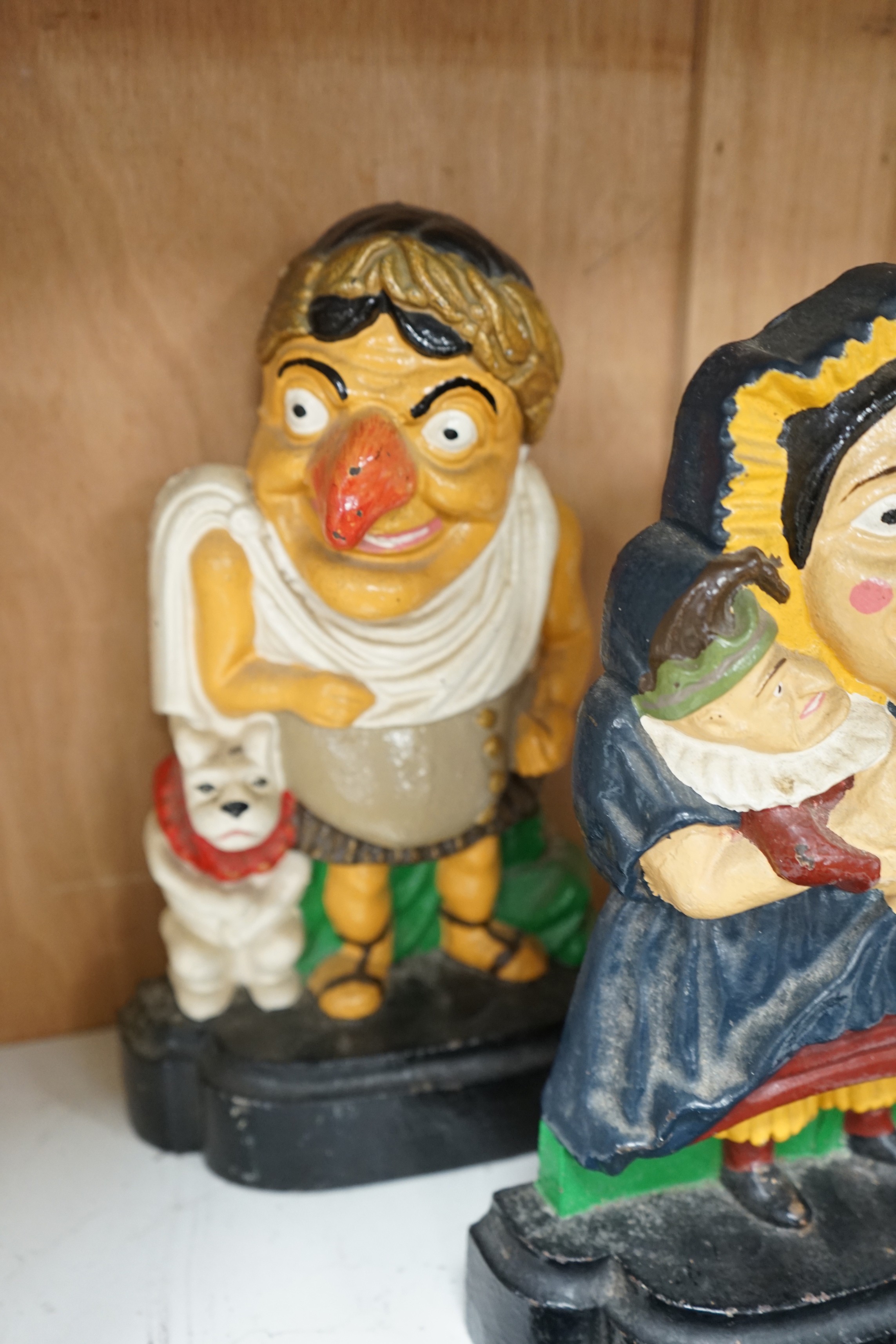Five assorted cast iron doorstops including a pair of painted Punch and Judy and a pair of flower - Image 5 of 5