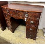 A George III style mahogany bow front kneehole dressing table, width 102cm, depth 54cm, height 84cm