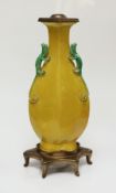 An early 20th century Chinese sancai glaze vase with lizard handle decoration, with lamp mount, 25cm