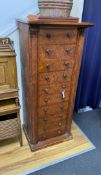 An early Victorian satinwood Wellington chest, of ten drawers, with side locking bar, width 59cm,