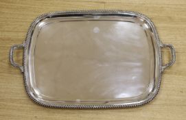 A George VI silver two handled rectangular tea tray, with gadrooned border, George Howson,