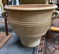 A Grecian style circular earthenware garden urn, diameter 62cm, height 50cm