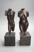 A bronze male and a female nude torso on stand (2), 27cms high