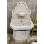 A sectional stone fountain by Latthies, width 79cm, depth 50cm, height 140cm