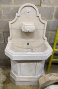 A sectional stone fountain by Latthies, width 79cm, depth 50cm, height 140cm