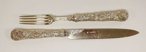 An ornate Victorian silver carving knife and fork, with fruiting vine handles, Francis Higgins,