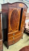 A George IV satinwood banded mahogany bow front linen press, adapted, width 130cm, depth 60cm,