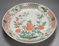 A large 19th century Chinese famille verte peony and dragon dish, 38.5cms diameter