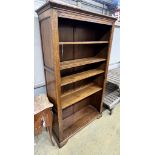 A reproduction oak open bookcase, width 100cm, depth 33cm, height 170cm