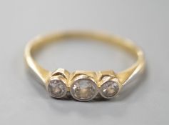 A yellow metal, Plat and collet set three stone diamond ring, size K, gross weight 1.9 grams.