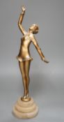 An Art Deco gilt metal model of a dancer on stepped alabaster base, 41cm
