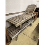 A pair of weathered teak garden loungers, length 180cm, width 58cm