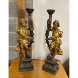 A pair of 18th century style carved pine parcel gilt figural lamp bases, height 75cm