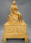 A 19th century French 'Pipe player' ormolu clock, 57cm tall