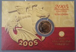 A 2005 gold sovereign, sealed in presentation card.