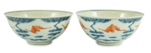 A pair of Chinese iron red and underglaze blue ‘five bat’ bowls, Guangxu mark and probably of the