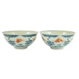 A pair of Chinese iron red and underglaze blue ‘five bat’ bowls, Guangxu mark and probably of the