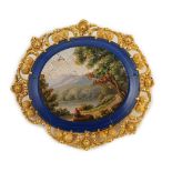 A 19th century Italian gold mounted micro-mosaic oval brooch, depicting a countryside scene, 54mm,