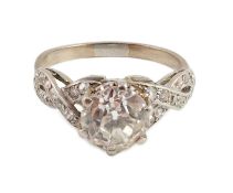 A mid 20th century white gold and single stone diamond ring, with diamond set crossover shoulders,