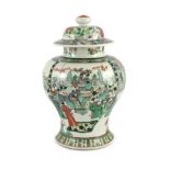 A Chinese famille verte jar and associated cover, 19th century, painted with an imperial court