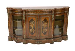 A Victorian marquetry inlaid walnut serpentine credenza, with ormolu mounts and floral marquetry