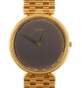 A gentleman's 18ct gold Piaget manual wind dress wrist watch, on an 18ct gold Piaget bracelet, the