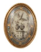 A Regency gold and inset ivory oval memorial ring, depicting initials below hearts and a dove,
