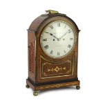 Molyneux & Cope of London. A Regency brass inset repeating bracket clock, with enamelled Roman