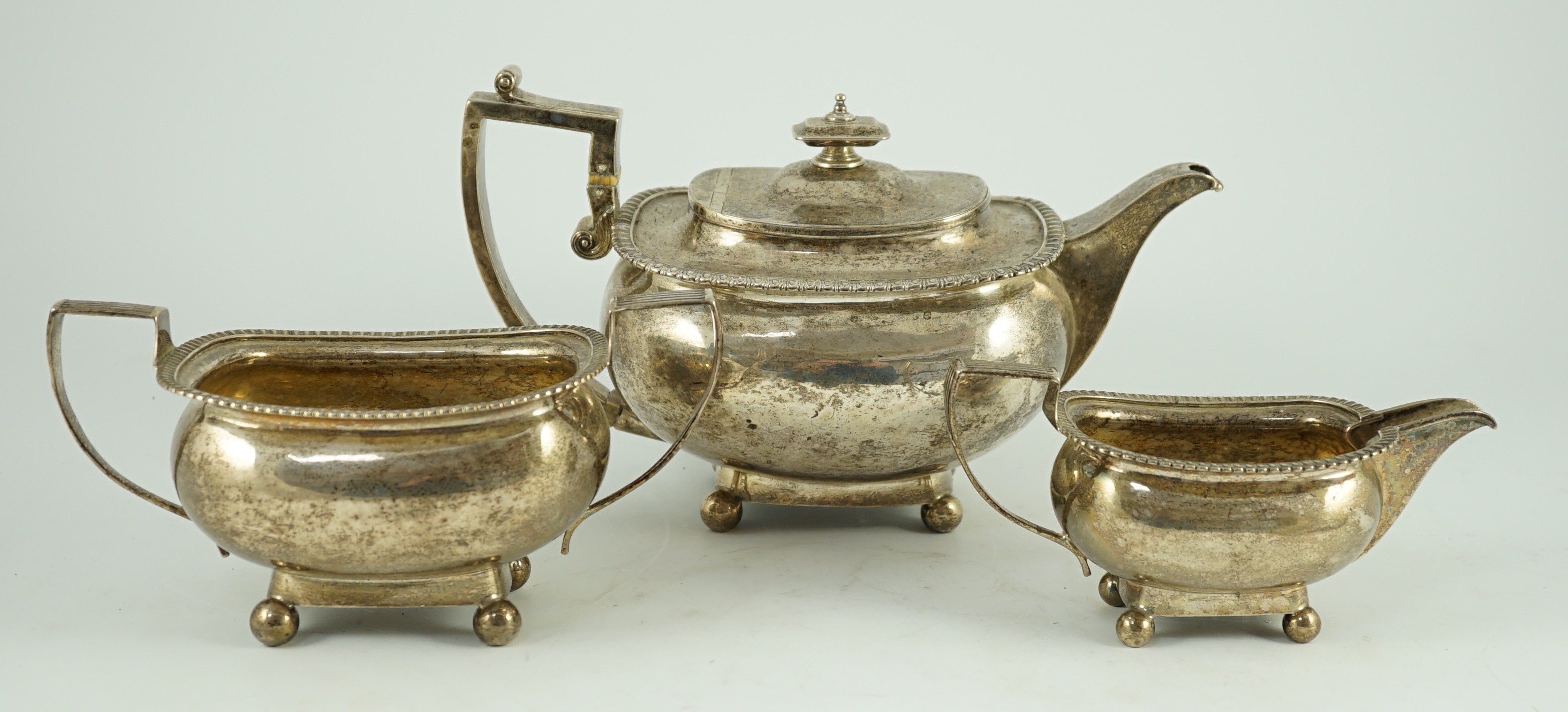 A George III silver three piece 'London' shape tea service, by Samuel Hennell, London, 1811, gross - Image 2 of 7