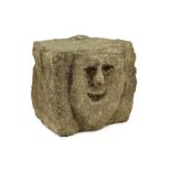 A rare Anglo-Saxon limestone mask corbel, 10th/11th century, the smiling face carved in bas-relief
