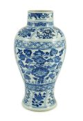 A Chinese blue and white vase, Kangxi period, painted with birds amid flowers and rockwork, within