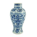 A Chinese blue and white vase, Kangxi period, painted with birds amid flowers and rockwork, within