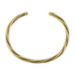 A modern Cartier 18k gold spiral twist open work bangle, signed and numbered 107998, 15 grams.**