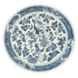 A Chinese blue and white 'blackbird' dish, 19th century, painted with blackbirds amid floral sprays,