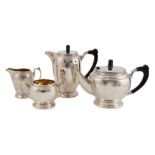 A George VI four piece silver tea set, by Harrods Ltd, of circular and ovoid form, Sheffield,