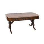 A Regency mahogany library table, with rounded rectangular top, two long and two dummy drawers, on