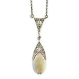 A 1920's gold and platinum, white opal and millegrain set diamond cluster pear shaped drop pendant