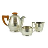 A stylish George VI silver three piece tea set, by Ls Sl, with bakelite handles, London, 1947, gross