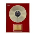 Sgt. Peppers Lonely Hearts Club Band, a framed gold disc, presented to EMI to recognise sales in the