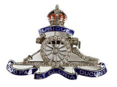 A white gold two colour enamel and diamond chip set Royal Artillery sweethearts brooch, 4cm, gross