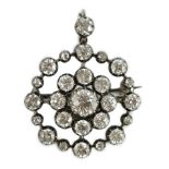 A Victorian gold, silver and diamond cluster set target pendant brooch, set with round cut stones,